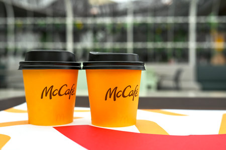 ABU DHABI - SEPT 20: Two paper cups with beverages at McCafe of McDonald's in Abu Dhabi on September 20.2024 in UAEのeditorial素材