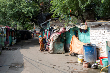 NEW DELHI - SEPT 18: Traditional small slums with daily routine in Delhi streets on September...