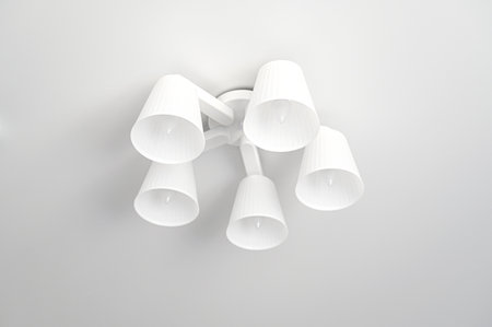 Some white lamps and ceiling in living roomの写真素材