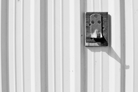 metal rusted hanger on a trapezoidal panelの写真素材
