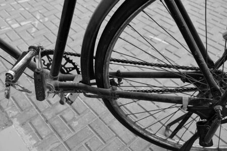 Old Retro style from the old school bicycle on the street pavementの写真素材