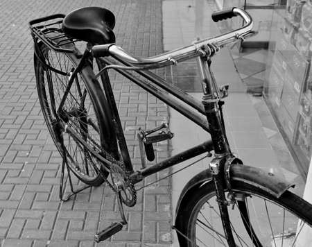 Old Retro style from the old school bicycle on the street pavementの写真素材