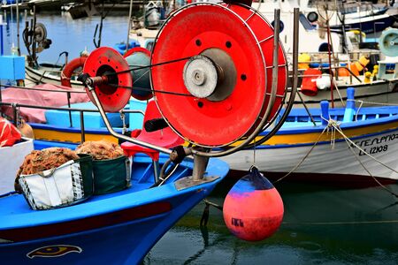 Close up shot of the fishing net reel on a fishing boatの写真素材