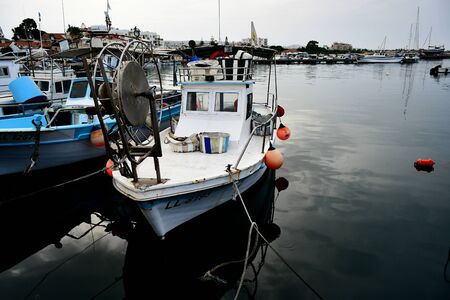 fishing boats in the port while rainingの写真素材