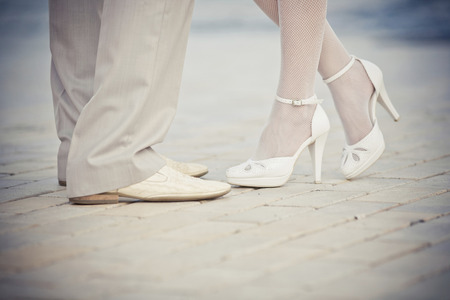Legs of a groom and a bride.の写真素材