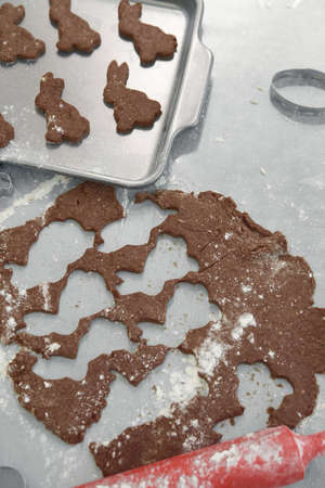 preparing chocolate cookies in the form of a traditional Easter rabbit