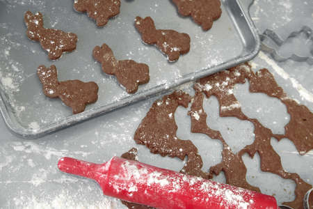 children prepare chocolate cookies in the ida of the traditional Easter rabbit