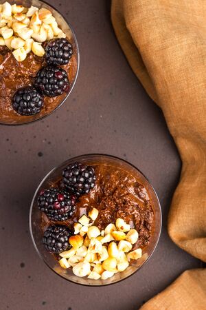 Dark chocolate mousse, macerated blackberries and roasted hazelnutsの写真素材