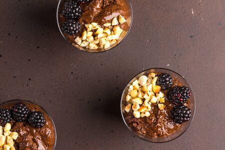 Dark chocolate mousse, macerated blackberries and roasted hazelnutsの写真素材