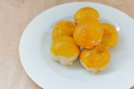 Chinese Pastry or Moon cake, dessert for Chinese new year on wood backgroundの写真素材