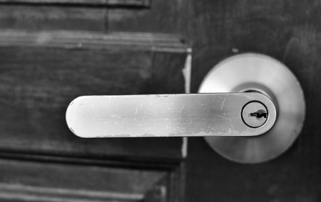 the part of wooden door with metal handleの写真素材