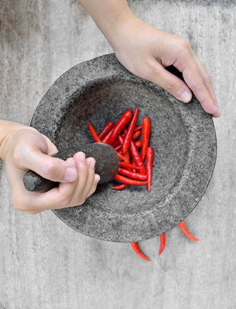 Women hand prepare cooking spicy foodの写真素材