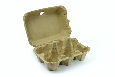 Empty egg box, open and brown cardboard isolated on white backgroundの写真素材