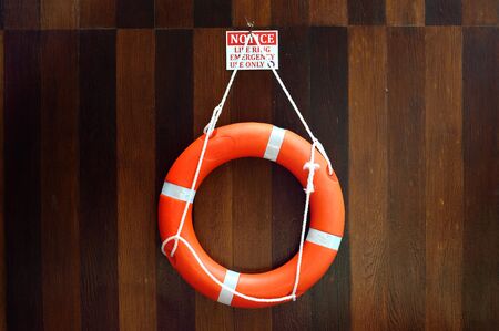 Lifebuoy hang on a wooden wall
