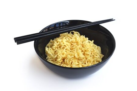 Instant noodles in the bowl on white backgroundの写真素材