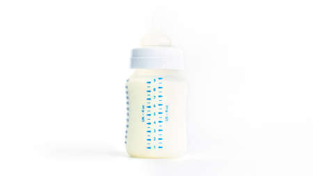 Baby bottle with milk on a white backgroundの写真素材