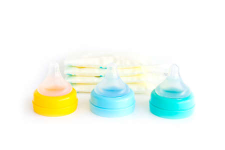 Stock of breast milk and pacifier on whiteの写真素材