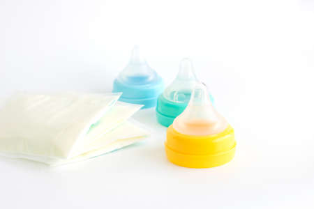 Bottle pacifier with breast milk stock on white backgroundの写真素材