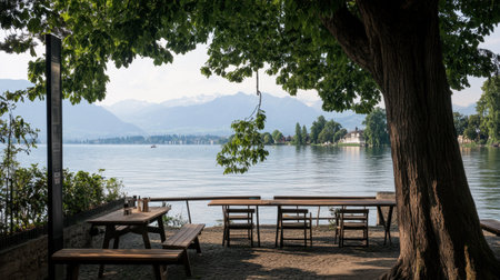 A cozy lakeside caf in Zurich with a stunning view of Lake Zurich and the Alps.の素材