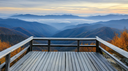 A wooden observation deck overlooking an expansive mountain landscape.の素材