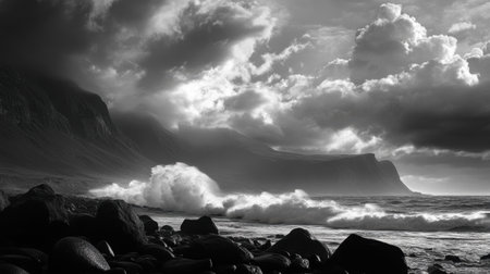 Waves crashing on rocky beach with spray frozen in time, dramatic clouds overheadの素材