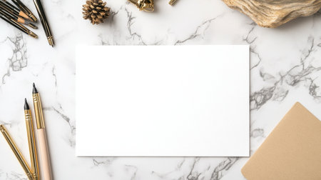 Greeting card laid on a marble desk with pens and pastel accessoriesの素材