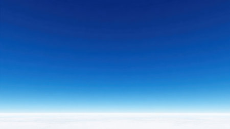 A breathtaking view of a clear blue sky stretches above a tranquil white horizon. This minimalistic landscape offers vast open space, ideal for various applications.の素材