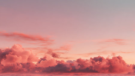A breathtaking view of a pink and blue sky at sunset showcases fluffy clouds that create a serene atmosphere. This image captures the tranquility of nature's evening beauty.の素材