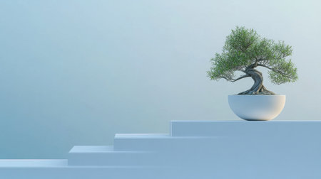 A serene bonsai tree in a white pot rests on a stair-like surface. The soft blue gradient background enhances the natural beauty and promotes a sense of calm.の素材