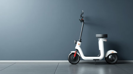 A stylish electric scooter stands against a minimalist gray wall, showcasing modern urban design. Ideal for those seeking eco-friendly transportation solutions in city life.の素材