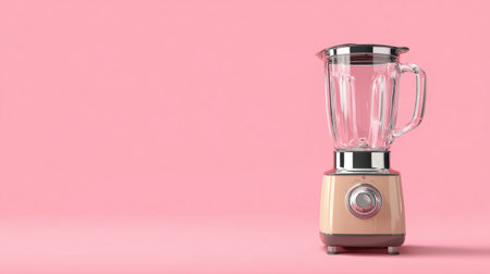 A modern kitchen blender showcasing a transparent jar and a stylish cream base, set against a soft pink background, ideal for food enthusiasts and culinary art.の素材
