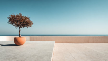 Captivating coastal landscape featuring a single potted tree, highlighting the tranquility of an ocean view under a clear blue sky. Perfect for minimalism themes.の素材