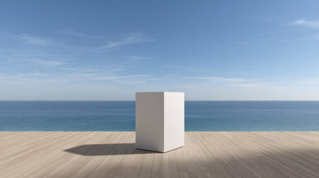 A serene scene featuring a minimalist white cube set on a wooden deck with an expansive view of the ocean, inviting feelings of peace and inspiration.の素材