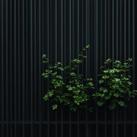 A captivating image showcasing lush green plants against a dark, textured wall with vertical stripes, perfect for enhancing the aesthetic of any modern space.の素材