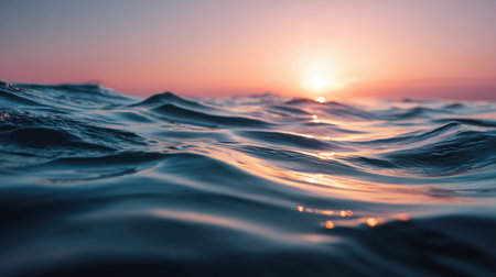 Beautiful ocean waves undulate gently as the sun sets on the horizon, creating a serene and tranquil atmosphere perfect for inspiration and relaxation.の素材