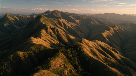 Explore a stunning aerial view of majestic mountains and rolling hills, filled with natural beauty and tranquility during sunset. Ideal for nature enthusiasts and travelers.の素材
