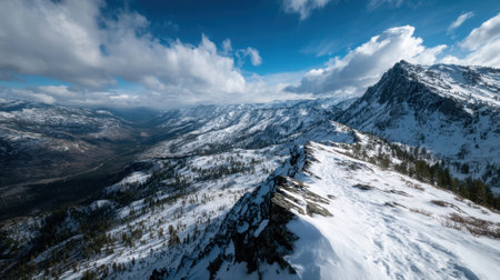 Experience a breathtaking view of snow-covered mountains under a striking blue sky, capturing the beauty of a serene winter landscape filled with nature's wonder.の素材