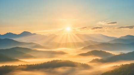 A breathtaking view of a serene sunrise over misty mountains, where soft rays of light illuminate the tranquil landscape, inviting exploration and reflection.の素材