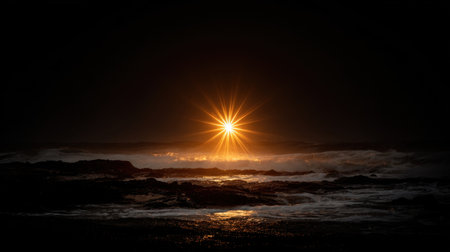 A captivating sunset casts a radiant starburst over ocean waves, creating a striking contrast between darkness and light, perfect for evoking tranquility and beauty.の素材