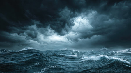 This striking image showcases turbulent ocean waves beneath a dramatic sky filled with dark clouds, embodying the raw power and beauty of nature in a stormy setting.の素材