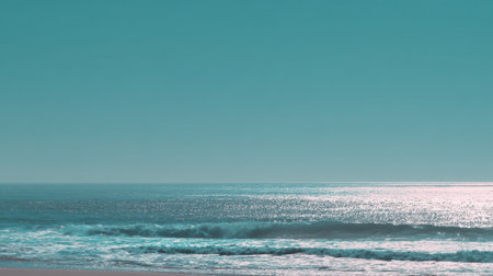 Experience the tranquility of a serene ocean view, where gentle waves meet a clear sky at dusk, creating a peaceful atmosphere perfect for relaxation and reflection.の素材