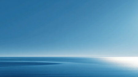 A tranquil ocean view with a clear blue sky and gentle water ripples. This serene landscape captures the essence of calm and peaceful natural beauty.の素材