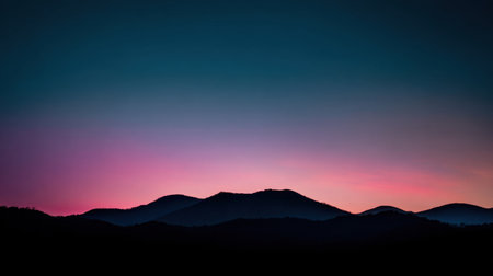 This enchanting landscape captures the beauty of dusk with soft hill silhouettes under a vibrant gradient sky. A perfect visual for nature lovers and tranquil settings.の素材