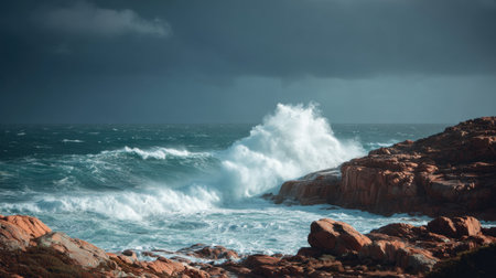 A breathtaking view of powerful ocean waves crashing against rugged rocks under a dark, stormy sky, capturing the essence of nature's wild beauty and force.の素材