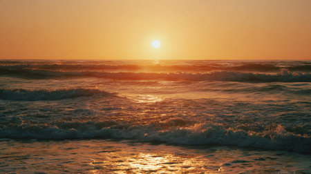 Capture the beauty of a serene sunset on the ocean with gentle waves and golden reflections illuminating the water, creating a tranquil and peaceful atmosphere.の素材