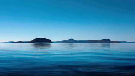 This captivating image showcases a tranquil ocean scene featuring distant islands and a clear blue sky. Perfect for evoking serenity and peace in design projects.の素材