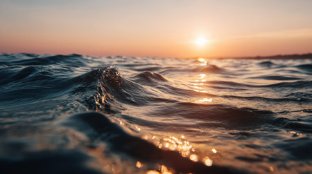 Captivating view of gentle ocean waves under a stunning sunset, showcasing vibrant colors and reflections that evoke peace and tranquility in nature.の素材