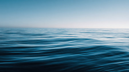 This image captures the serene beauty of the ocean, featuring gentle waves and a clear blue sky that create a tranquil atmosphere perfect for nature lovers.の素材