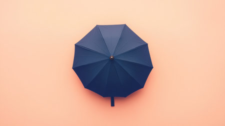 This image features a blue umbrella against a soft pastel pink background, capturing a clean and minimalist aesthetic ideal for diverse creative projects.の素材