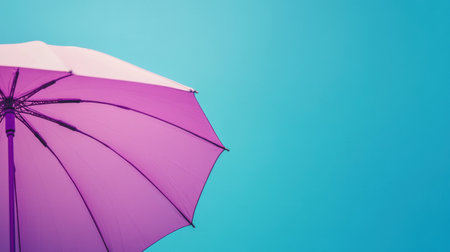A vibrant purple umbrella captured against a clear bright blue sky, evoking a sense of summer warmth and relaxation, perfect for seasonal themes and outdoor settings.の素材